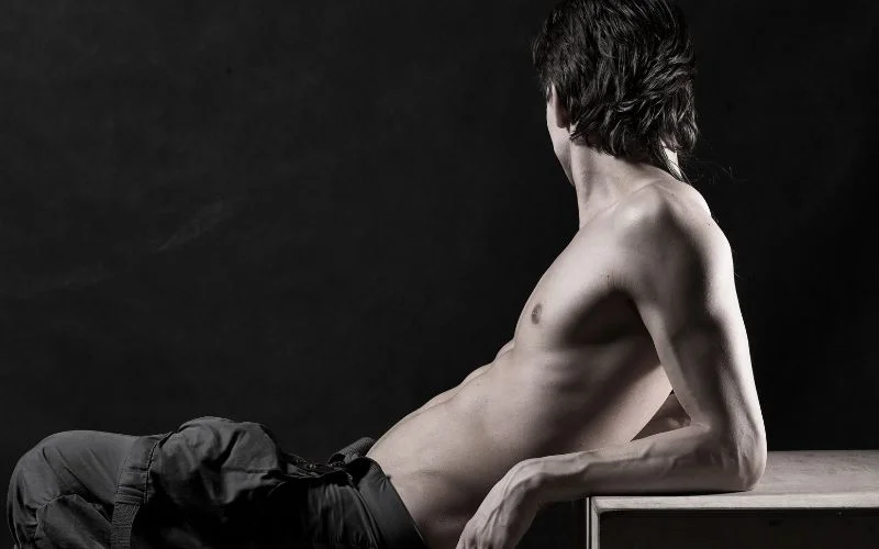 Reclining male nude pose in artistic fine art photography style