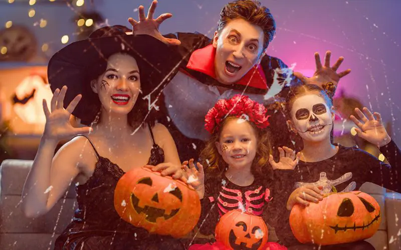 Spooky Halloween overlay applied to group photo with costumes, pumpkins, and purple lighting