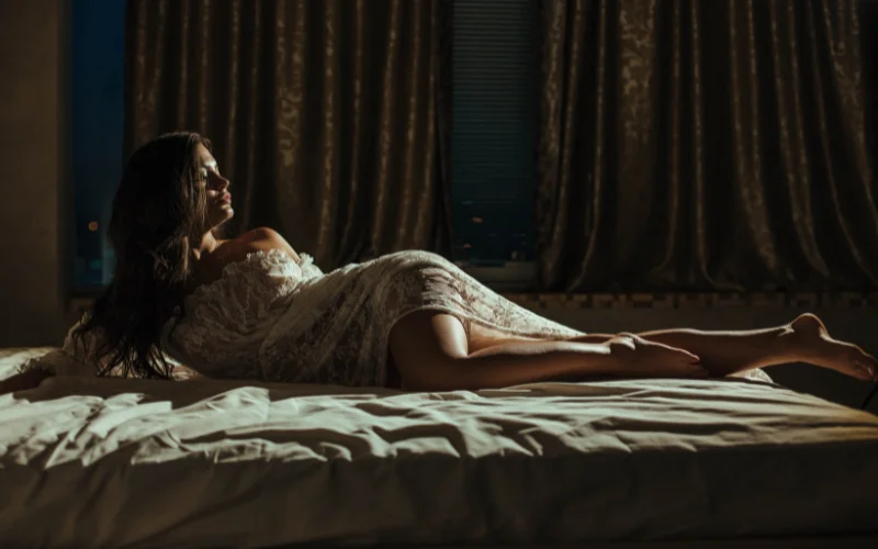 woman in a seductive pose with moody lighting