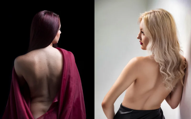 Model facing away from camera, back and shoulder line softly lit for a minimalist artistic shot