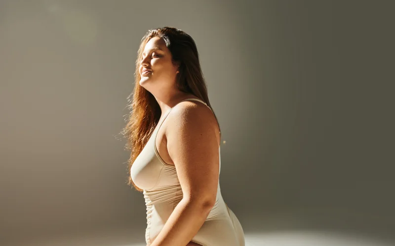 Free-flowing dance-inspired pose captured in warm natural sunlight