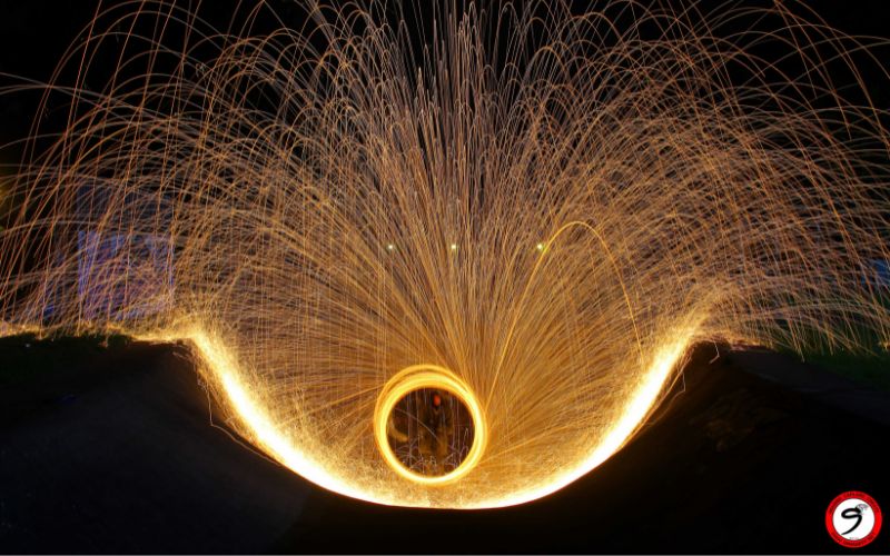 Long exposure steel wool technique transforming simple scenes into visually striking night images