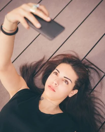 Selfie captured from a unique angle above or below eye level, adding visual interest and fresh selfie ideas.