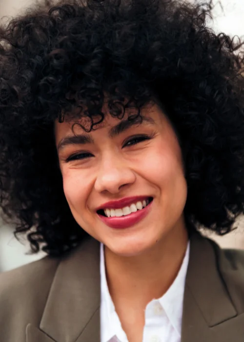 Close up pose with a warm smile, perfect for a professional headshot.
