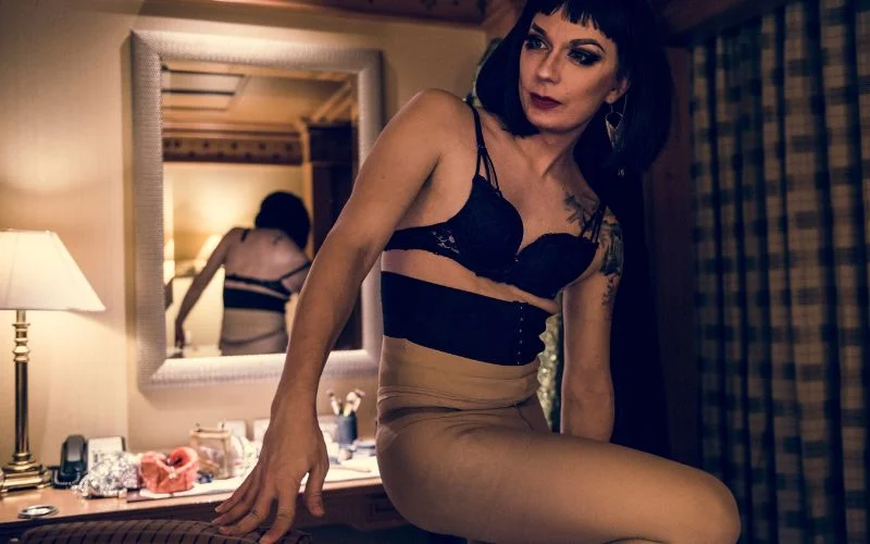 Boudoir style photos highlighting confidence, femininity, and expressive body language