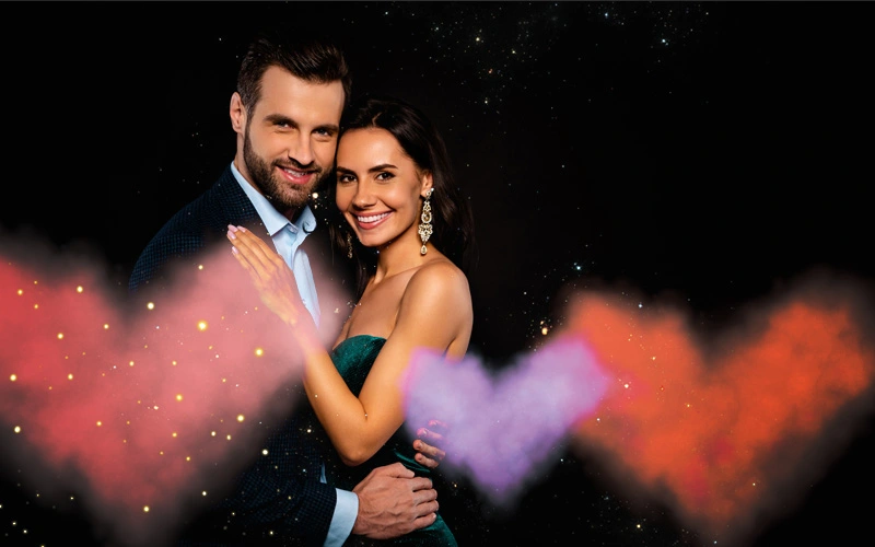 Valentine's Day overlay of pink and purple heart-shaped smoke effect on couple portrait