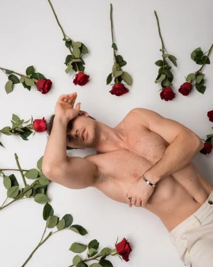 Male boudoir portrait using minimal props for clean and intimate composition