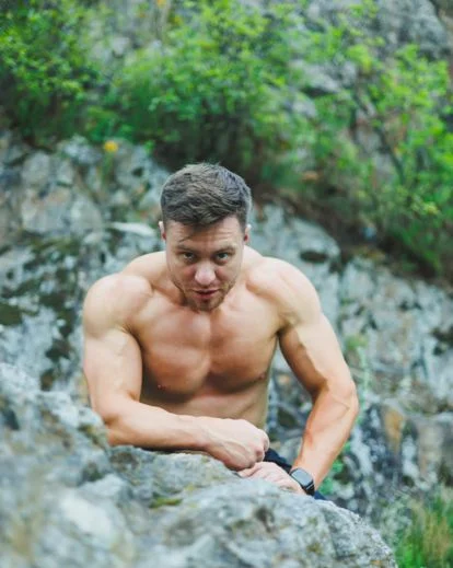 Outdoor men boudoir photography pose with natural light and masculine styling