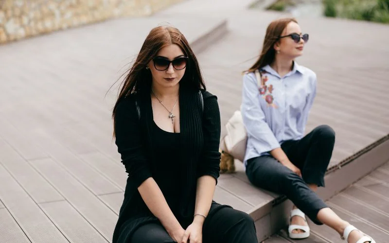 Creative group sitting pose with subjects positioned at different heights