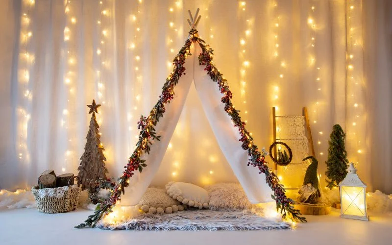 Strings of warm fairy lights arranged as a soft glowing DIY photography backdrop