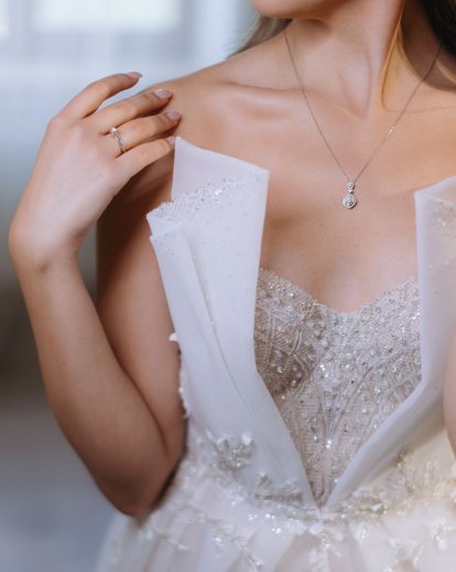 Ripping off wedding dress in a dramatic divorce photoshoot representing emotional liberation