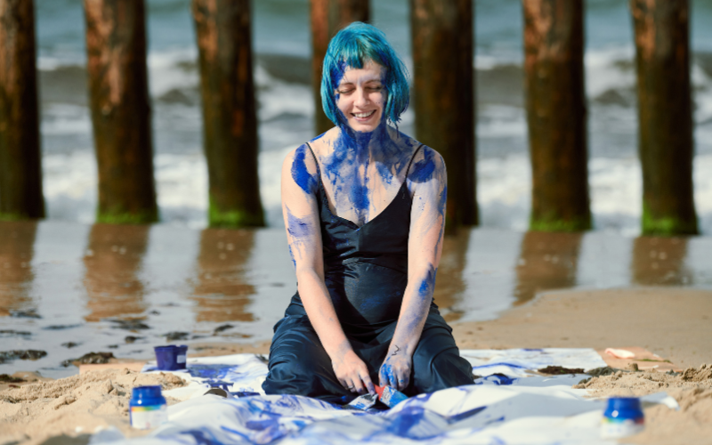 Wedding dress paint smash photoshoot showing creative expression and emotional release after divorce