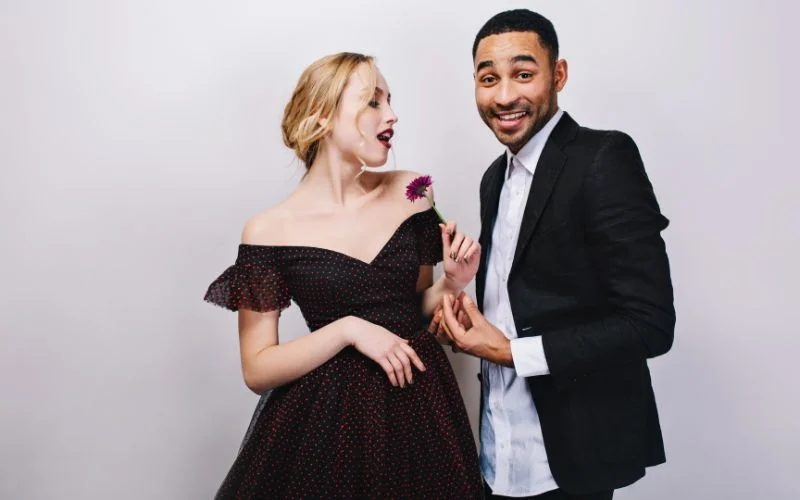 Cute prom picture pose of a couple laughing together in formal wear