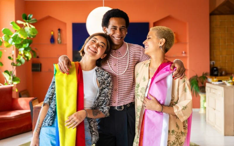 image of a man and two women stealing glances and smiling