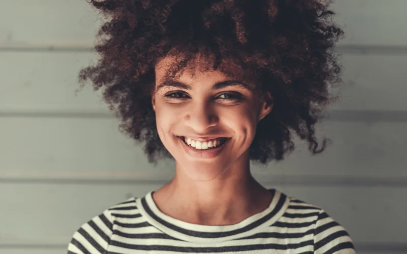 Natural candid portrait showing authentic emotion and relaxed smiling expression