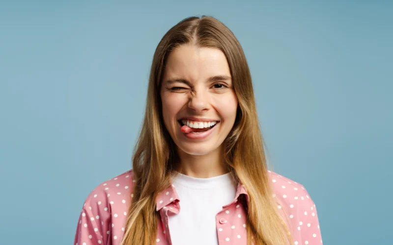 Close-up portrait demonstrating subtle mouth positioning for a natural smile in pictures