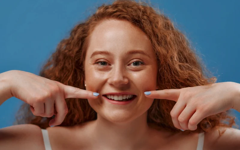 Bright genuine smile with visible teeth showing how to do a good smile for photos
