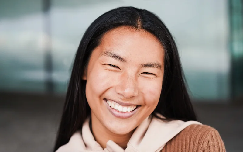 Soft closed-mouth smile example showing how to smile for pictures without showing teeth