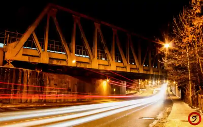 Create dynamic light trail photography images that showcase movement and depth with perfect long exposure settings.