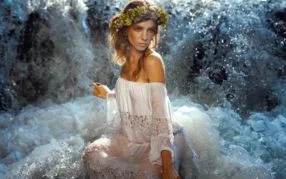Photo editor using layer masks in Photoshop to create clean subject cutouts and composites